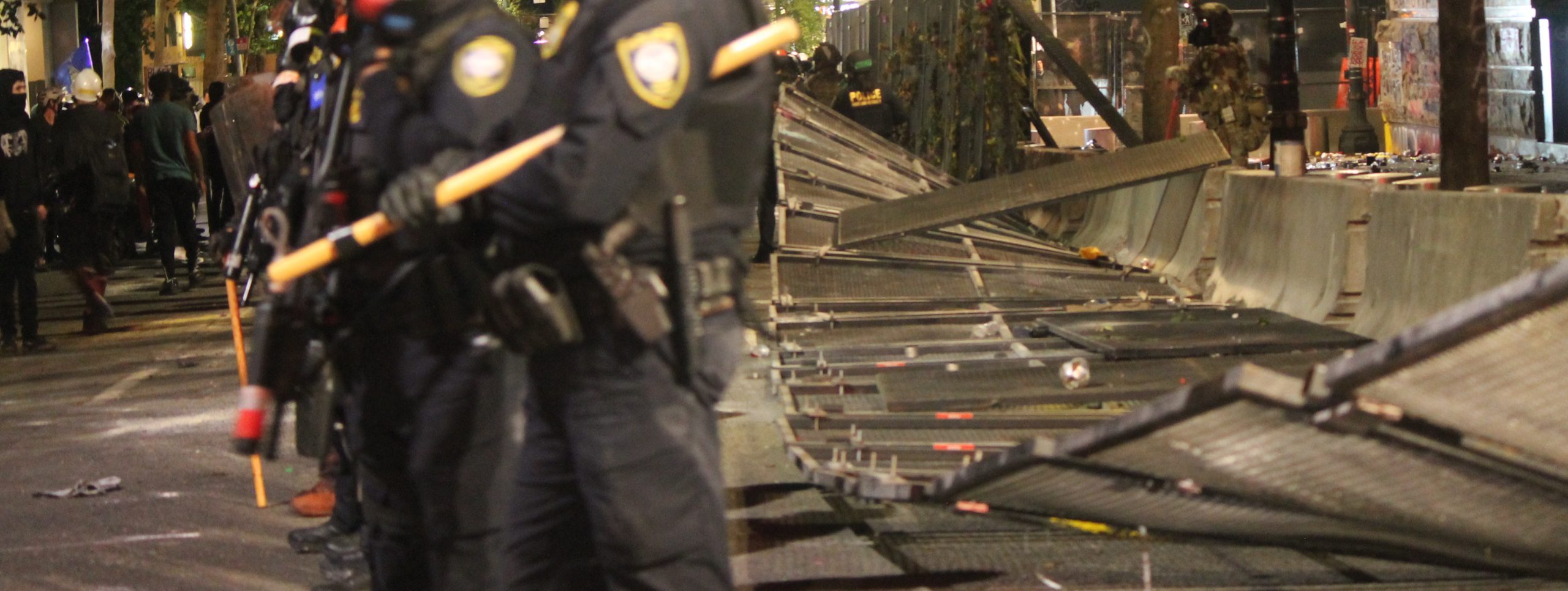 Protestors In Portland Tip Federal Courthouse Fence Saturday; Riot Declared by Police