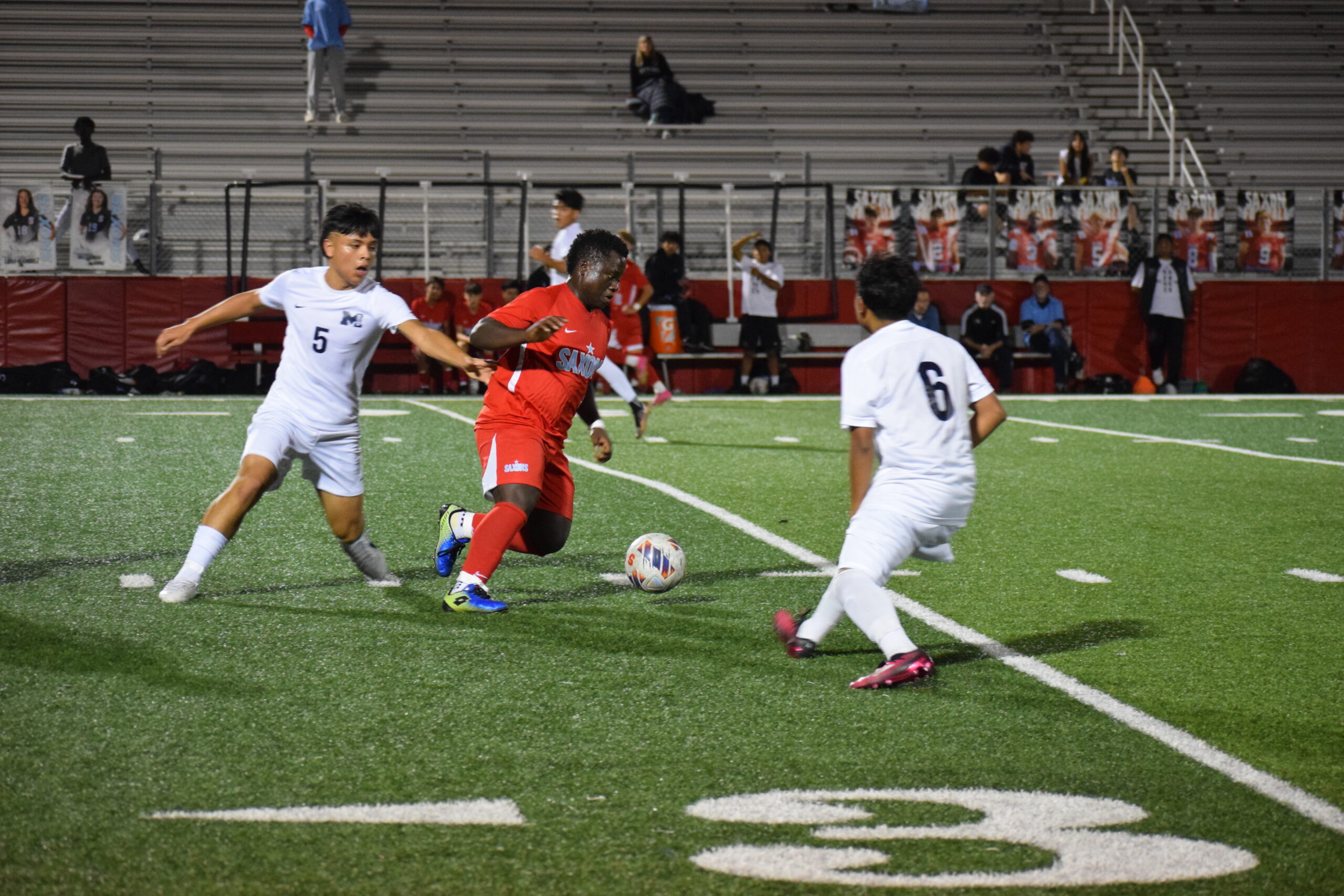 South player Frank Kilongo dribbles the ball between defenders