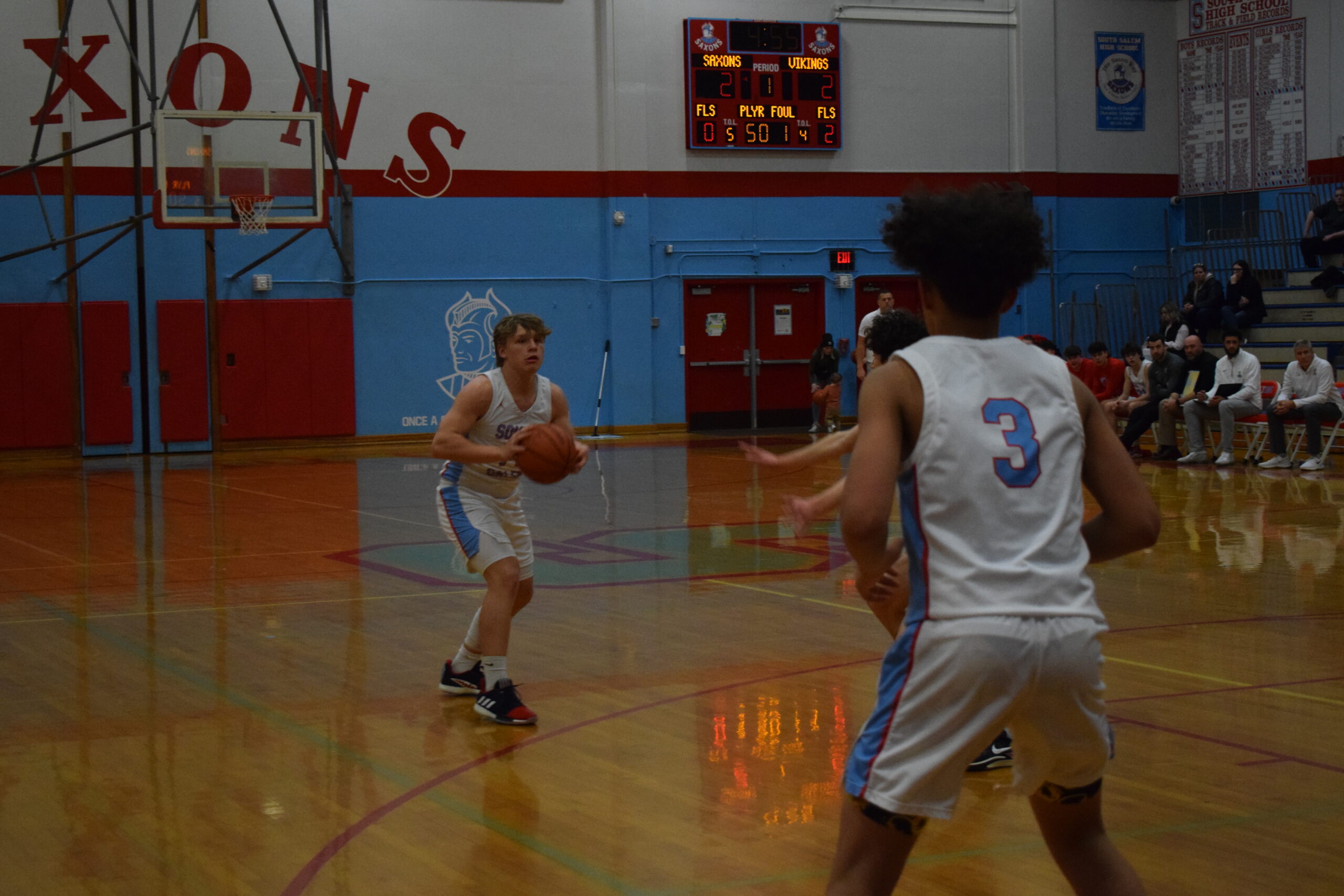 Teagan Scott '26 of South Salem High School looks to pass the ball to Tko Westbrook '26 during a game against West Salem High School