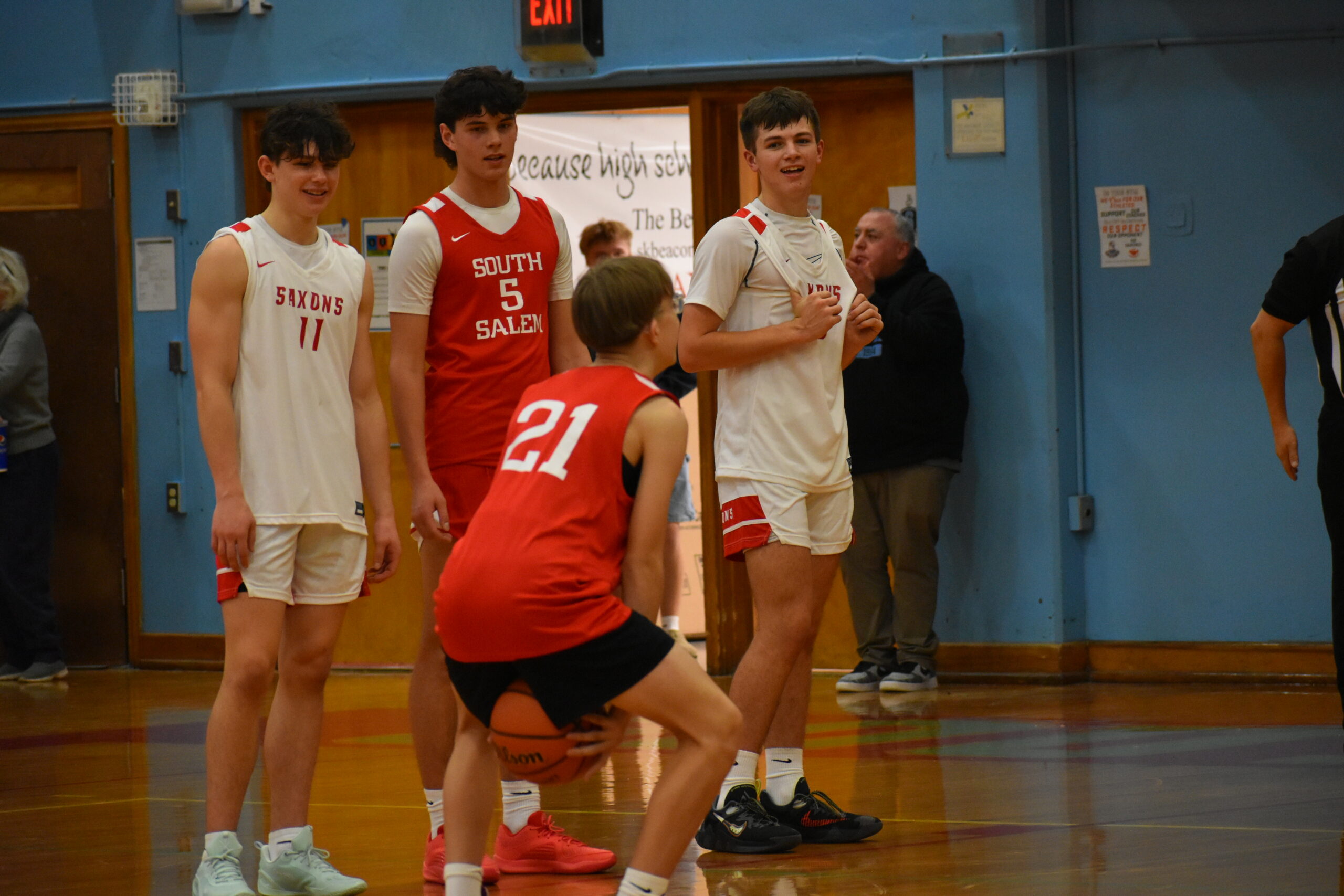 Gus Spencer '26, enacts a scene from "The Office" and attempts a free throw by throwing under-handed.