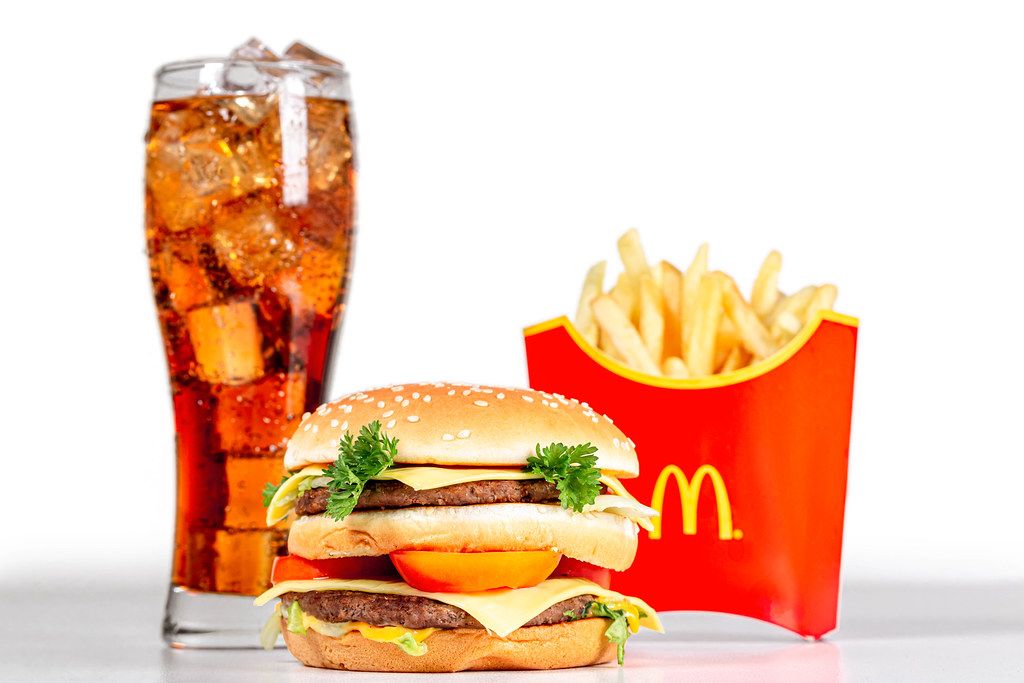 Image of a McDonald's burger, french fry and Coca-Cola.