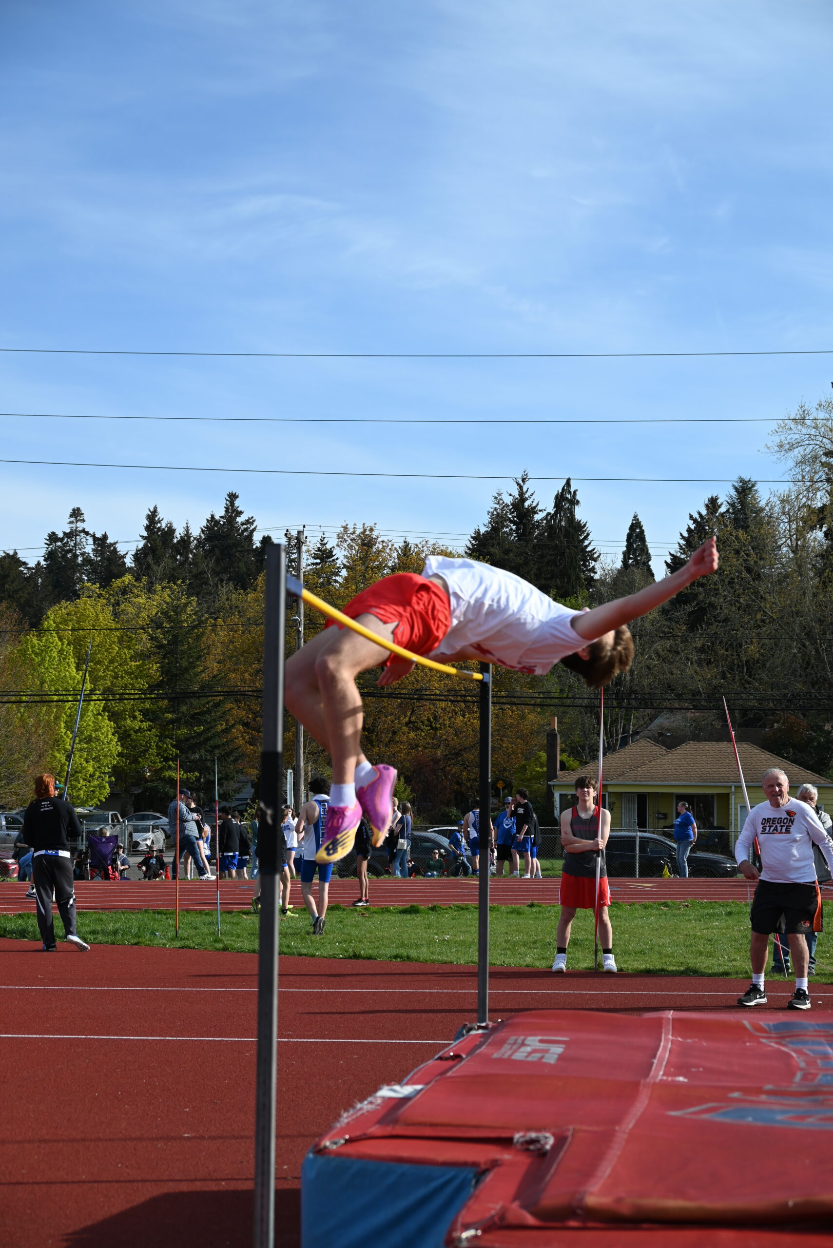 Track athlete performs high jump. Photo taken by Stephanie Romeo.