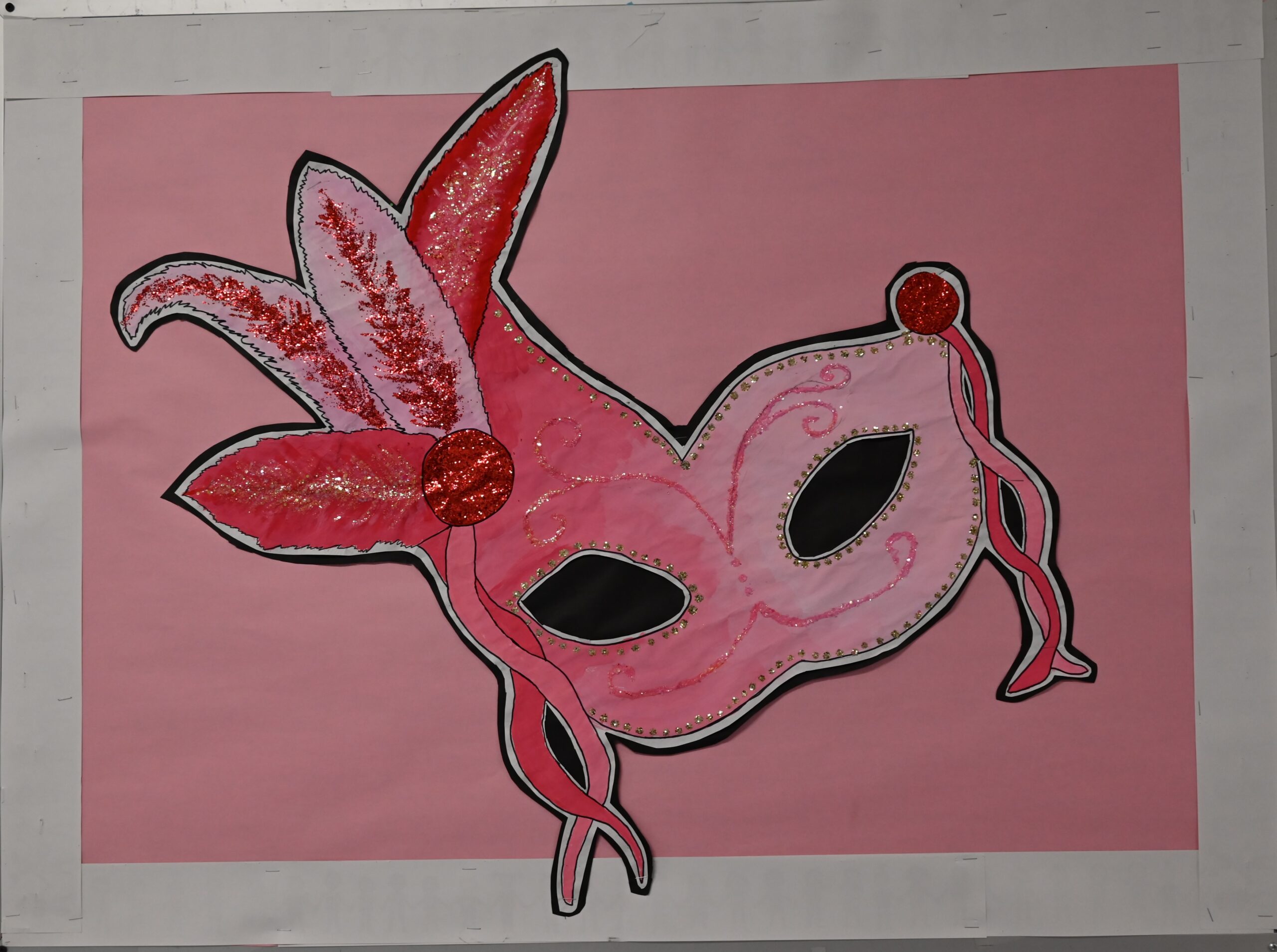 Prom poster with masquerade mask.