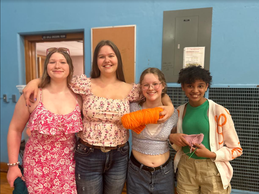 Students a part of the Crochet Club pose together. Photo taken by Audrey Willmschen.