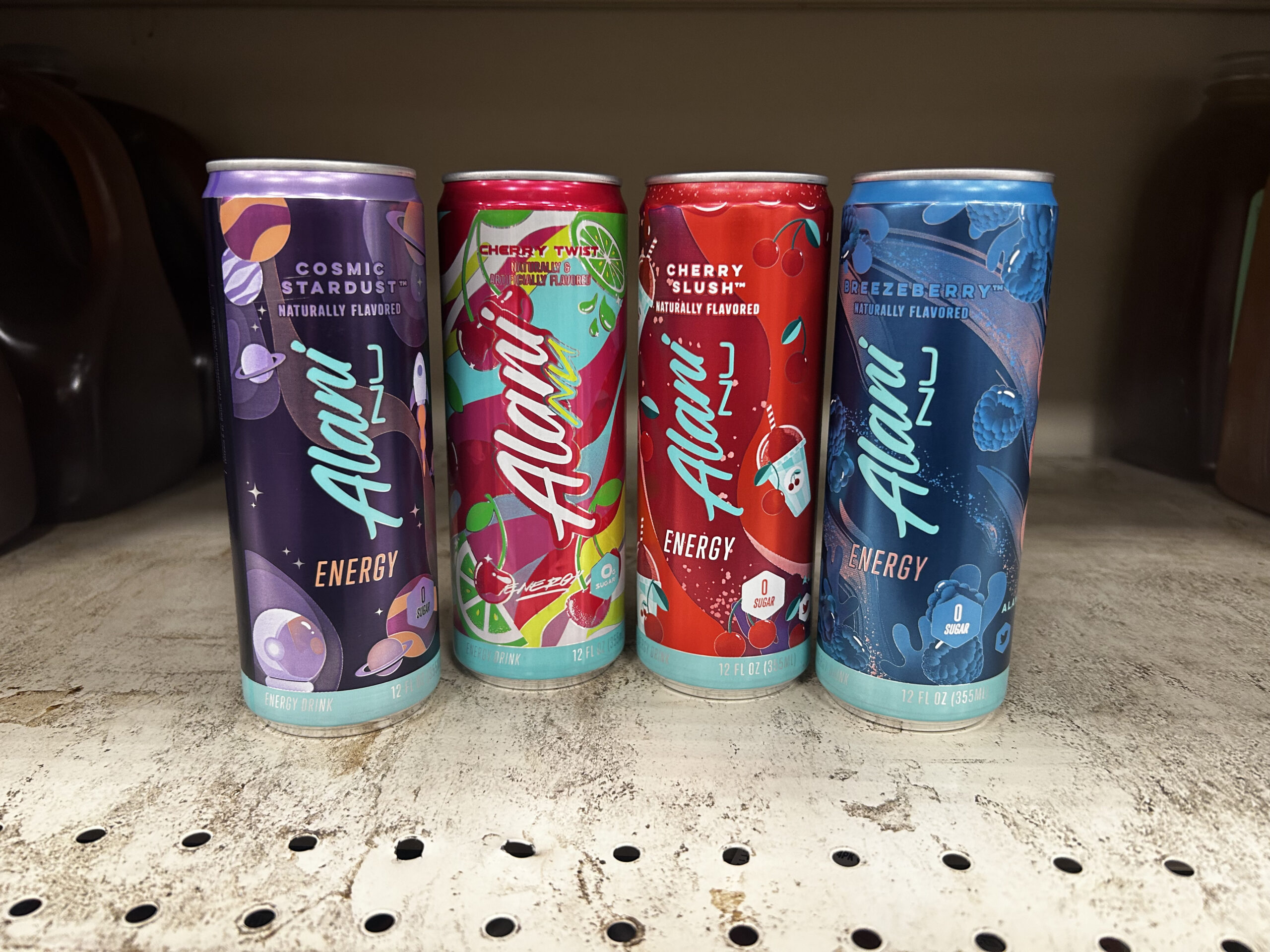 A photo of Four Alani Nu energy drinks on shelf in South Salem's Fred Meyer