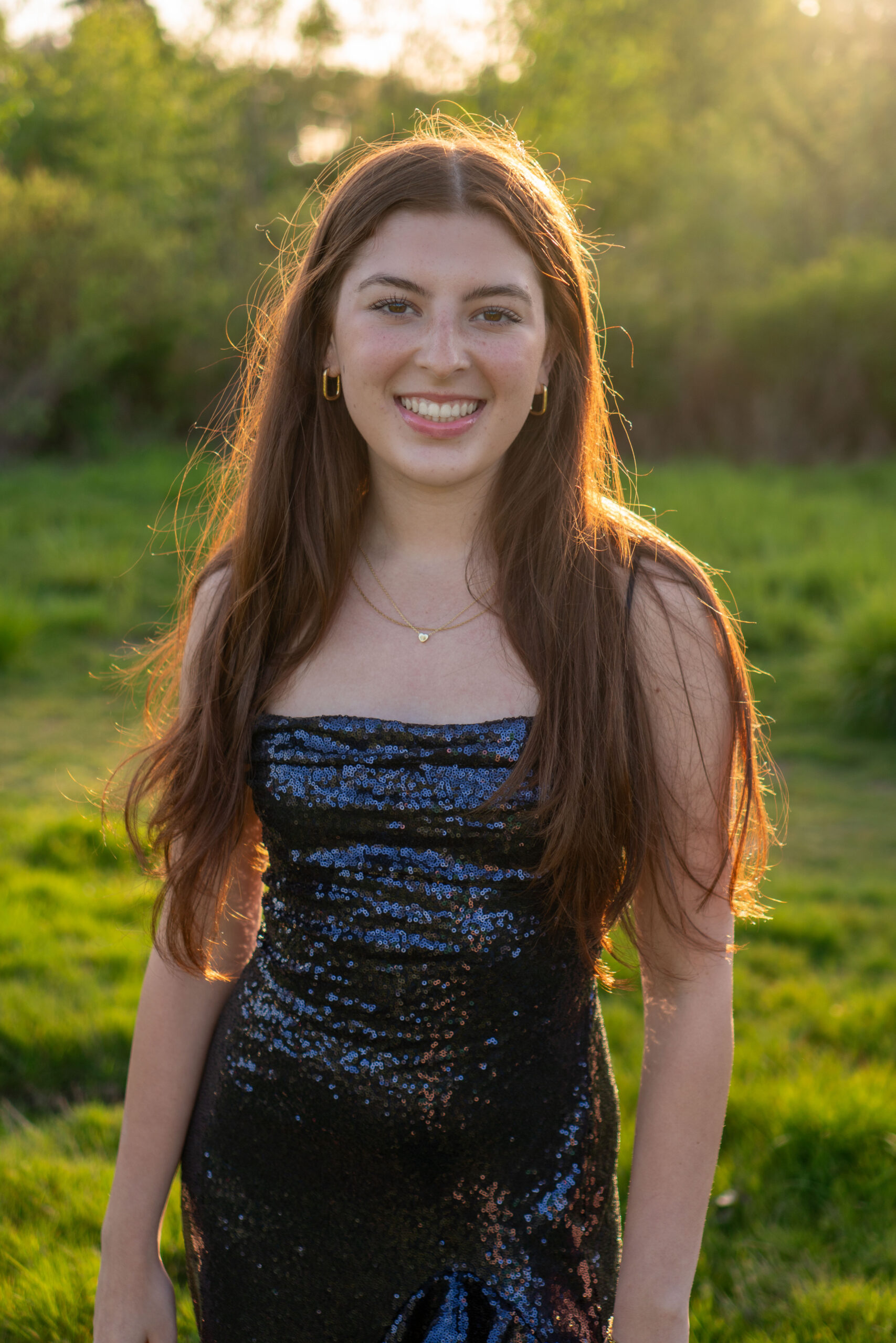 Ashley Ingebrigtsen, '25, poses for a picture at her house in her prom dress. Photo via Sharlie Jenkins, '26.