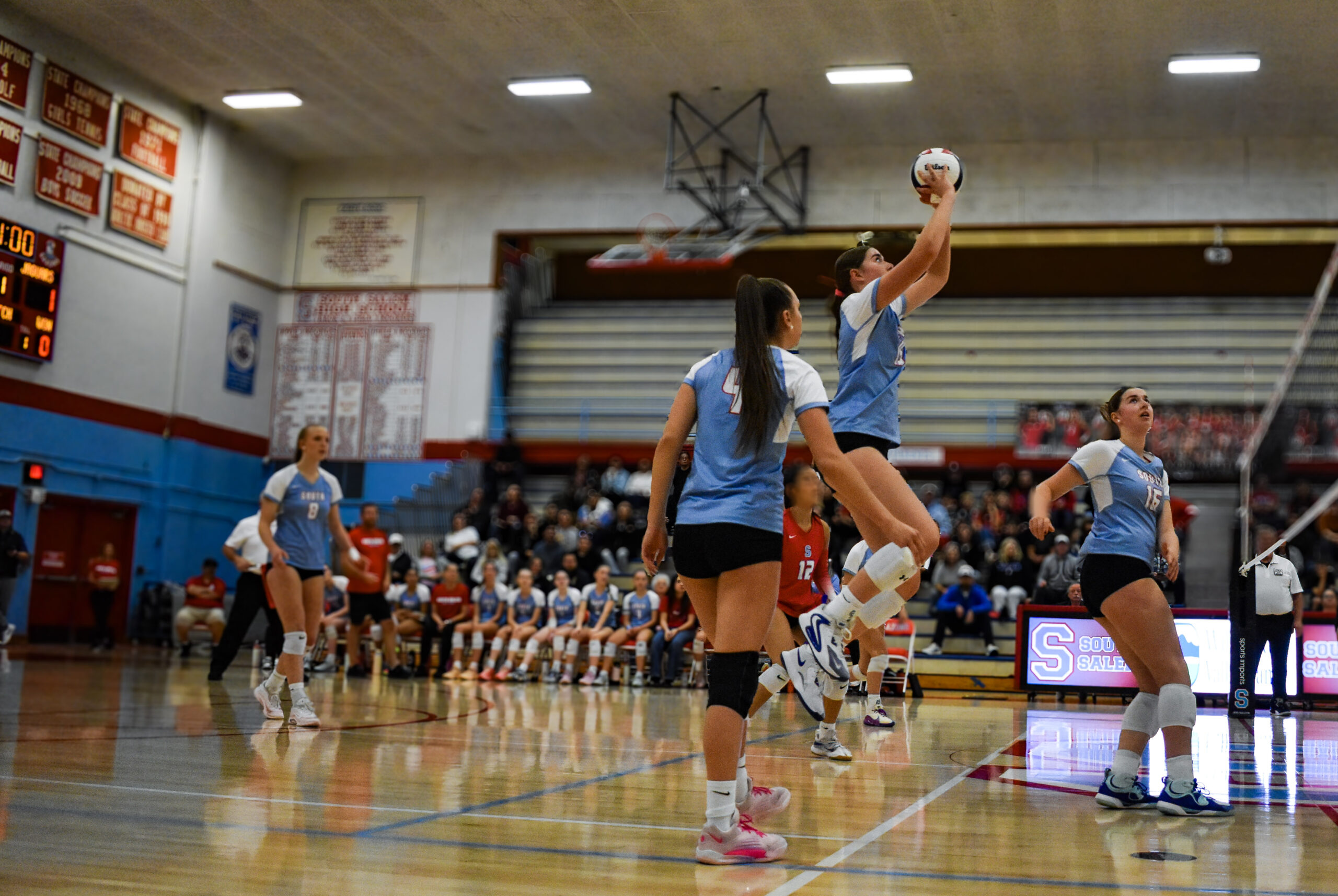 South Salem middle blocker Nora Kartye, '28 jumps to set the ball over the net during the first round of the OSAA 6A Volleyball Playoffs against Century High School.