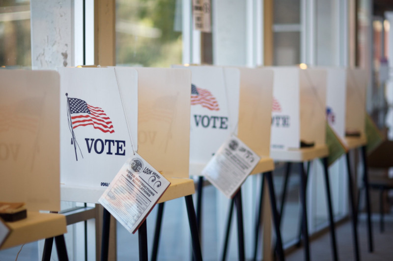 Voting booths by Penn State licensed under Creative Commons.