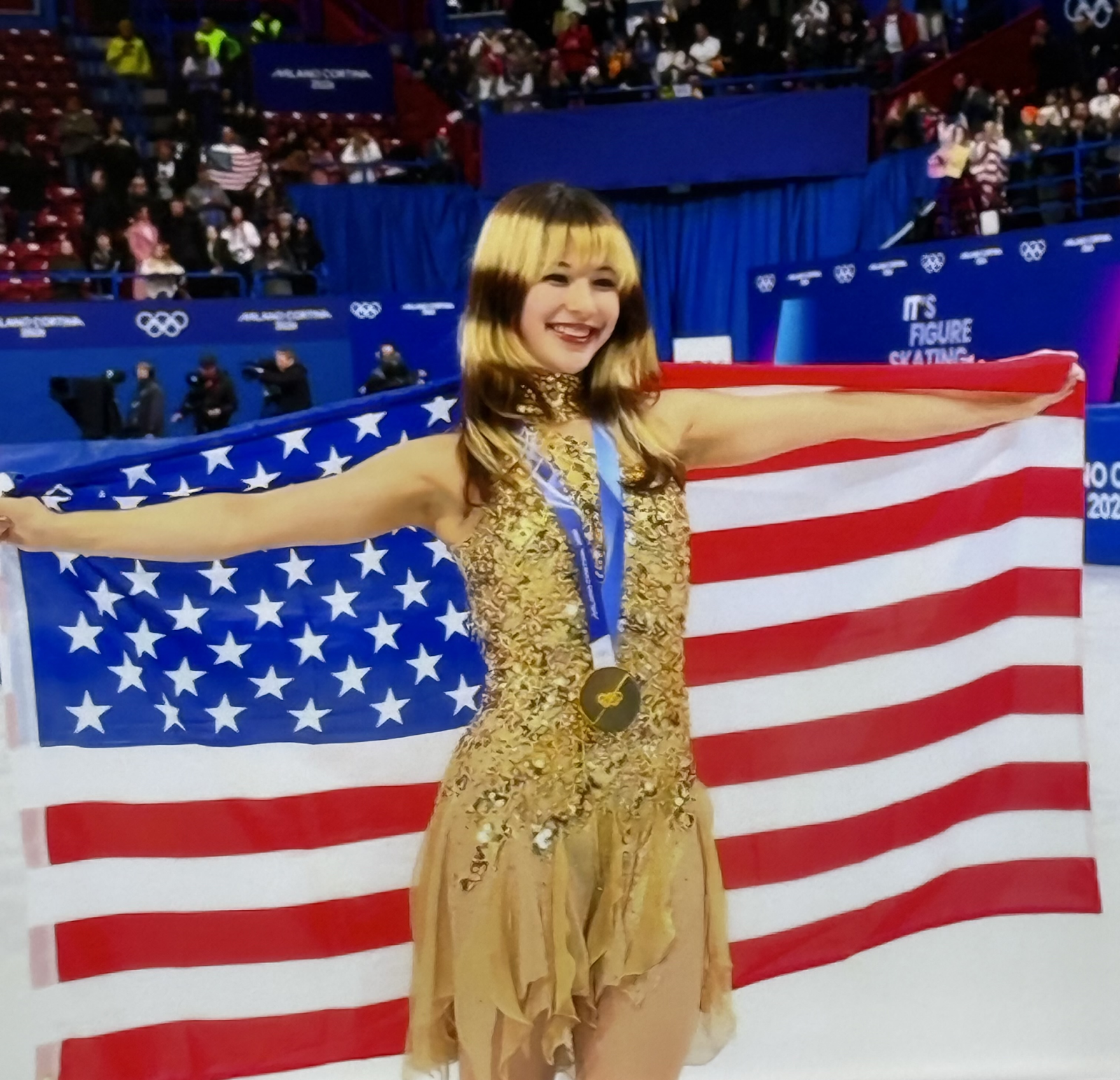 Alysa Liu Holding the American Flag with her Gold Medal