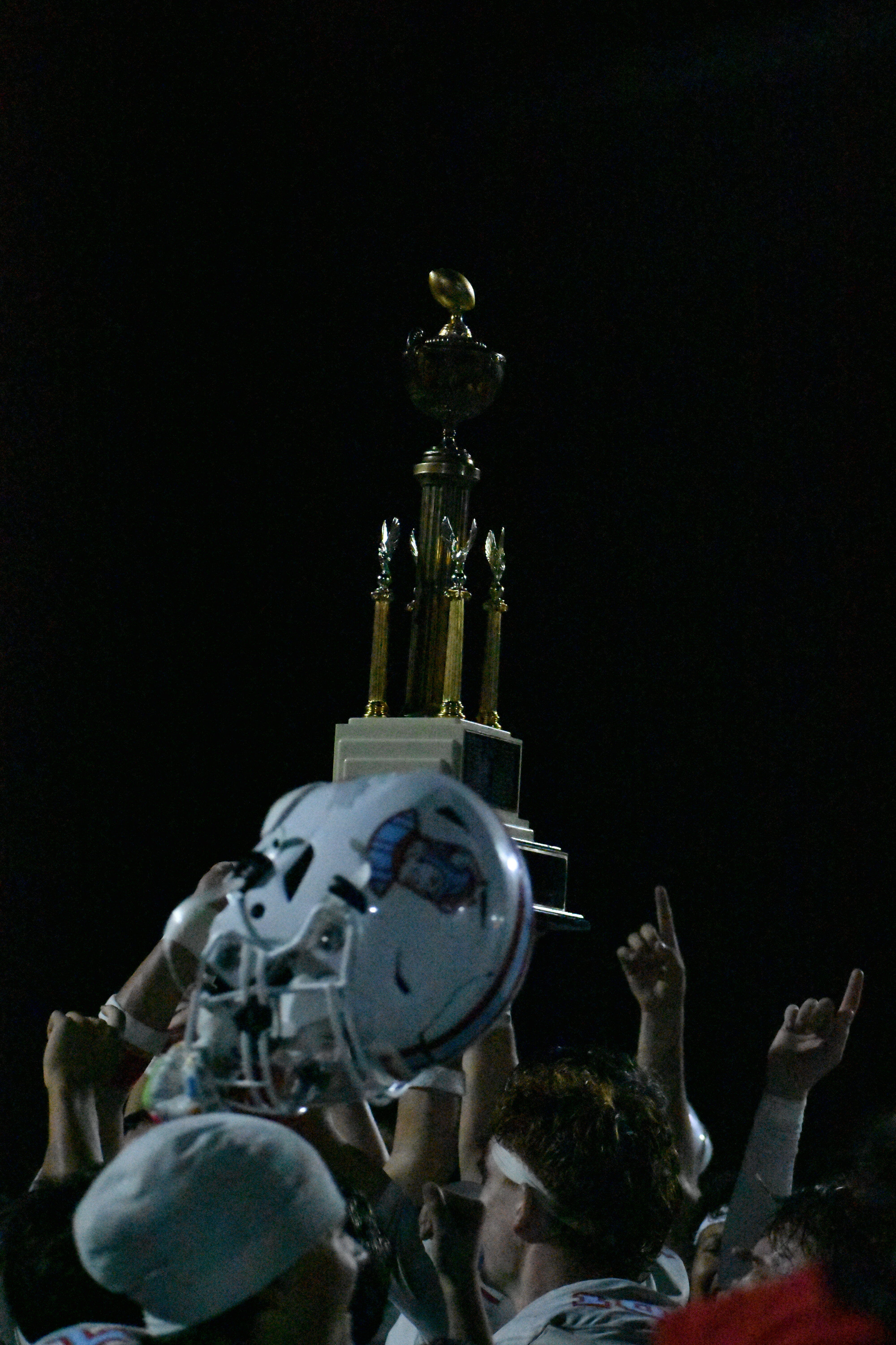 Saxon Football team holding Mayor's Cup Trophy